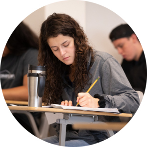 A student taking notes in class.